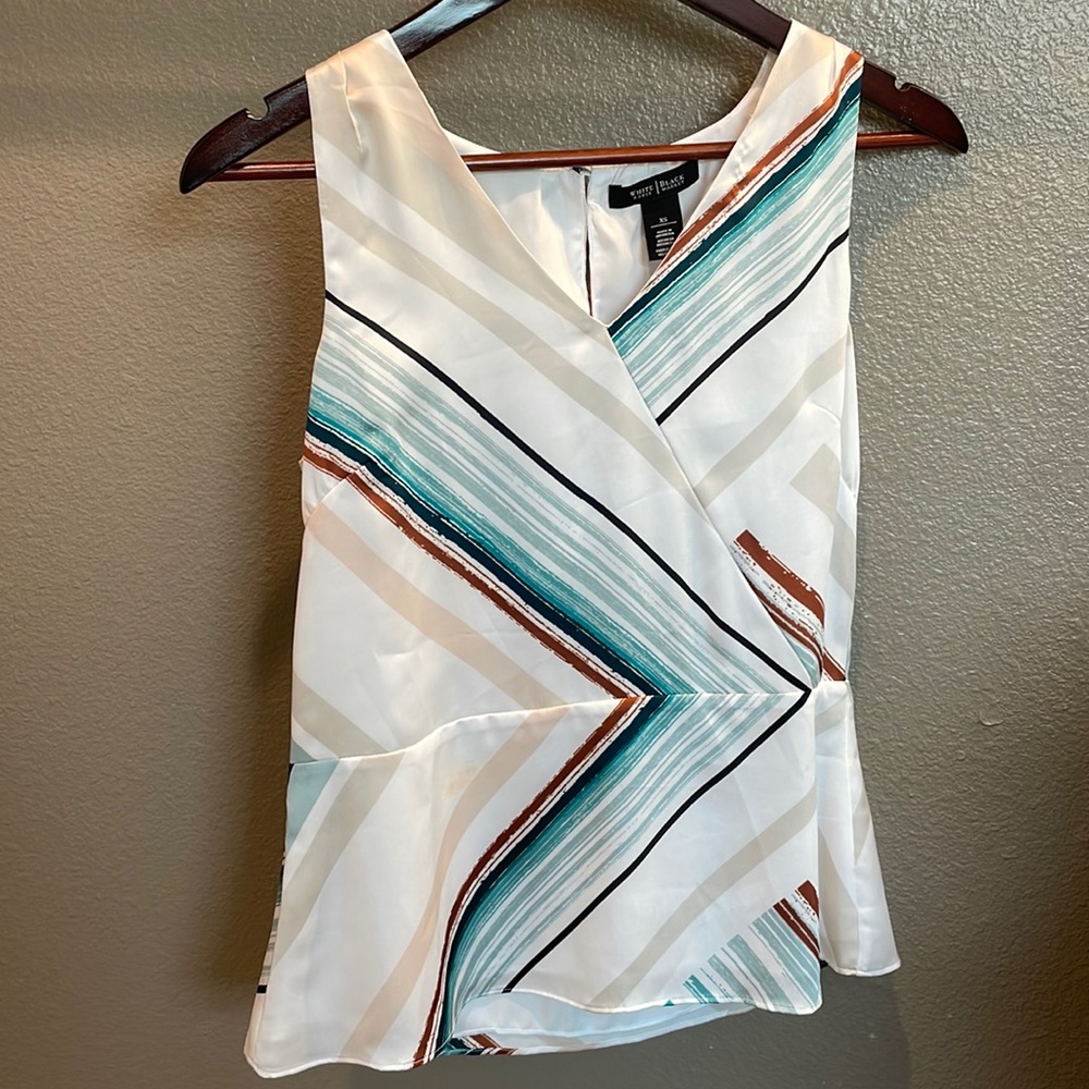 White satiny feel sleeveless shirt with green/blue/tan/brown stripes